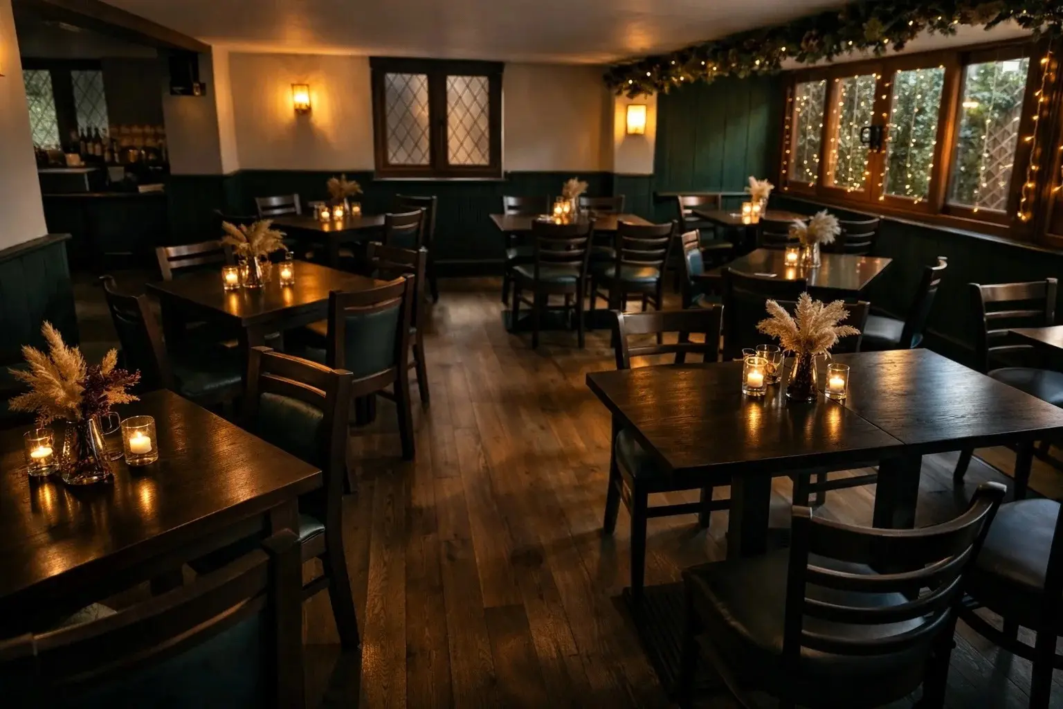A quiet, candlelit dining space at The Yew Tree, Maidstone